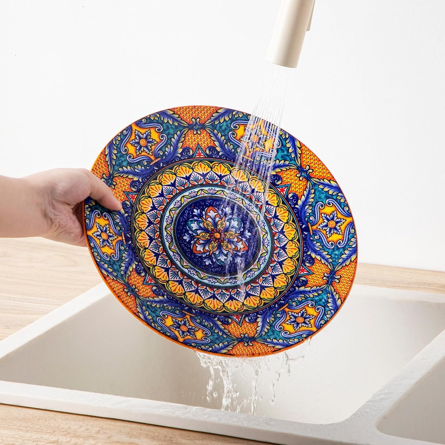 Hand washing smooth surface of Bohemian Dinnerware Set plate
