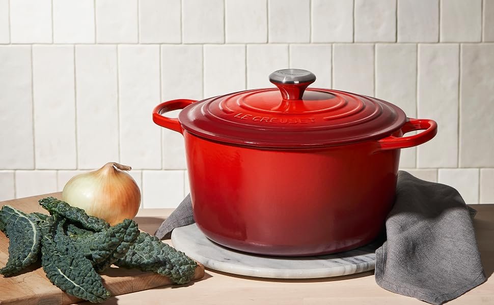 Le Creuset Enameled Cast Iron Dutch Oven in vibrant red for family stew