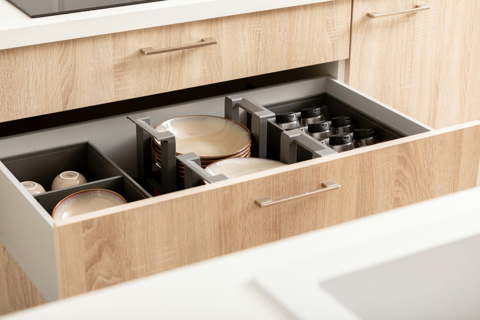 Kitchen drawer organized with dividers and separate storage sections