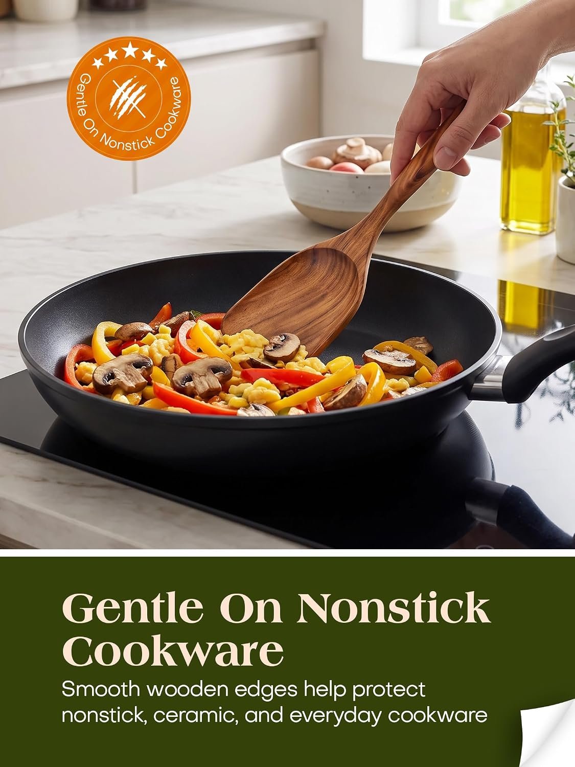 Natural teak wooden kitchen utensil set serving food in nonstick pan