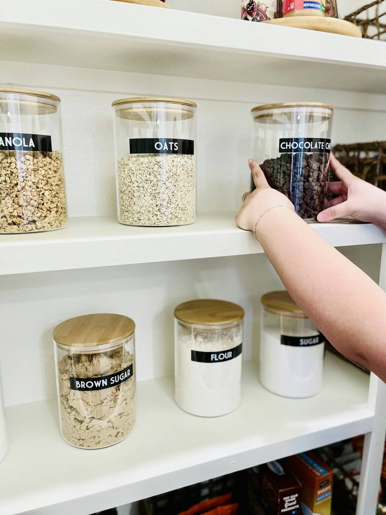Labeled pantry containers for oats flour sugar and other ingredients