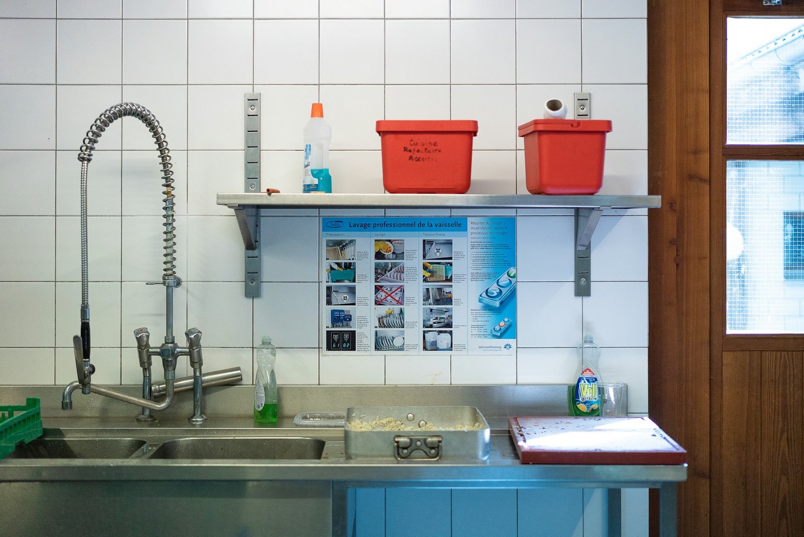 Two tier organizer maximizing storage inside an under sink cabinet
